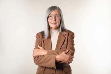 Photo of Portrait of beautiful senior woman on light background
