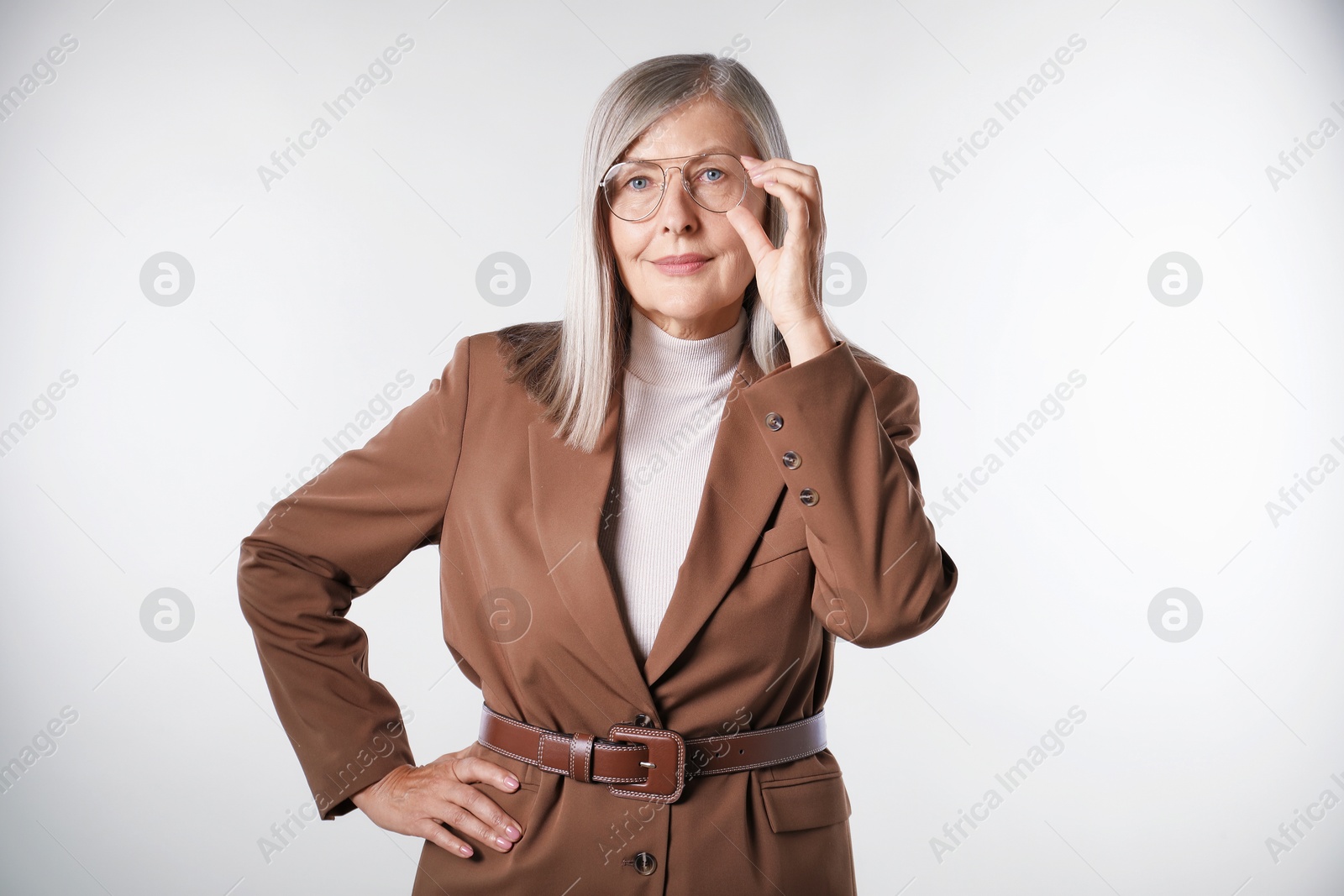 Photo of Portrait of beautiful senior woman on light background