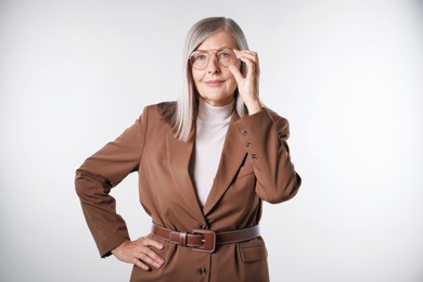 Photo of Portrait of beautiful senior woman on light background