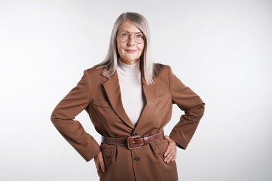 Photo of Portrait of beautiful senior woman on light background