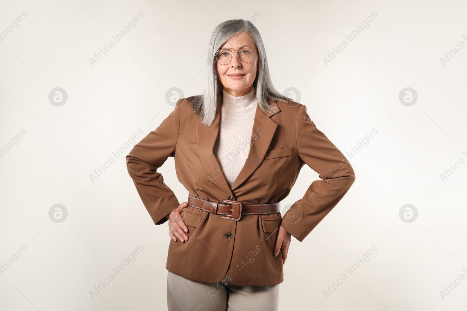 Photo of Portrait of beautiful senior woman on light background