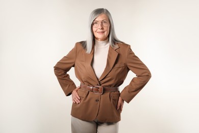 Photo of Portrait of beautiful senior woman on light background