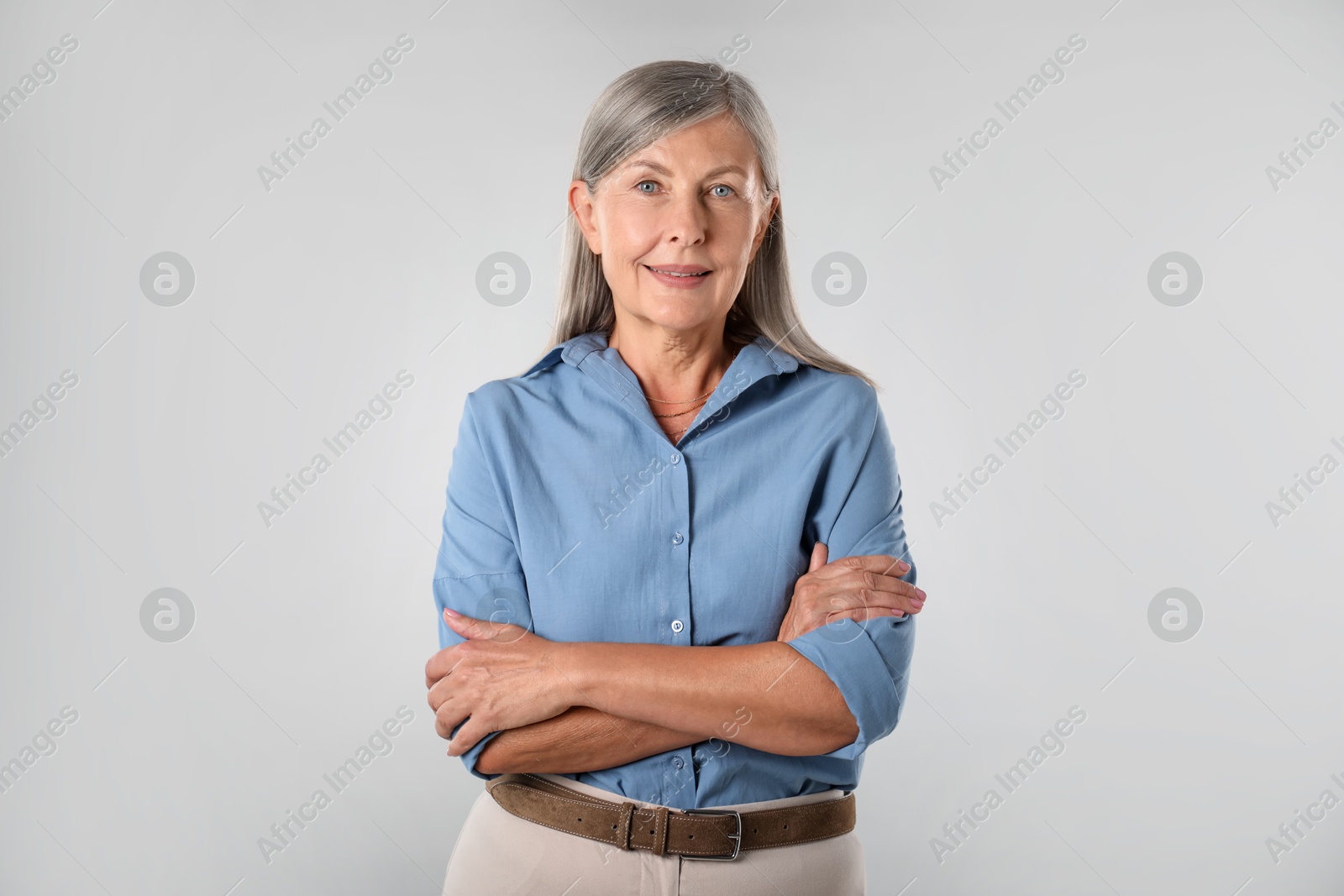 Photo of Portrait of beautiful senior woman on white background
