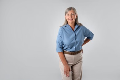 Photo of Portrait of beautiful senior woman on white background. Space for text
