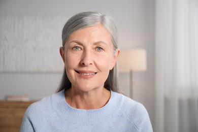 Photo of Portrait of elegant senior woman at home