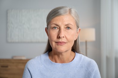 Photo of Portrait of elegant senior woman at home