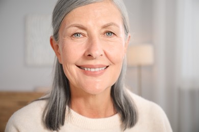 Photo of Portrait of elegant senior woman at home
