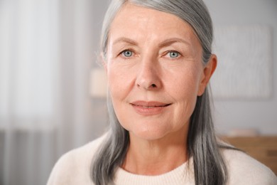 Photo of Portrait of elegant senior woman at home