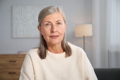 Photo of Portrait of elegant senior woman at home