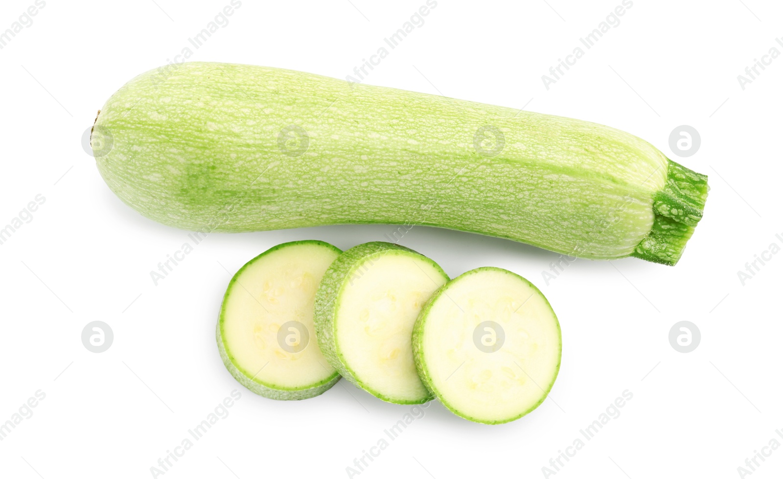 Photo of Fresh whole and cut zucchinis isolated on white, top view