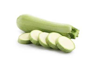 Photo of Fresh whole and cut zucchinis isolated on white