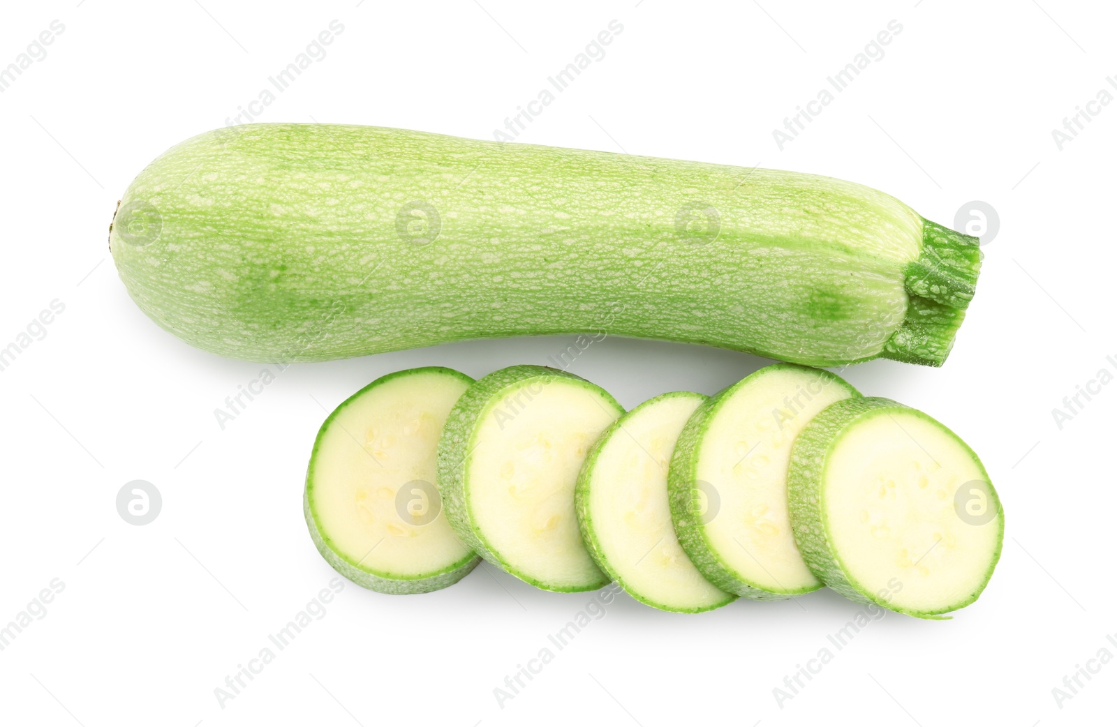 Photo of Fresh whole and cut zucchinis isolated on white, top view
