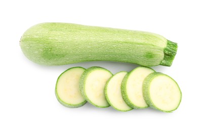 Photo of Fresh whole and cut zucchinis isolated on white, top view
