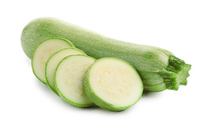 Photo of Fresh whole and cut zucchinis isolated on white