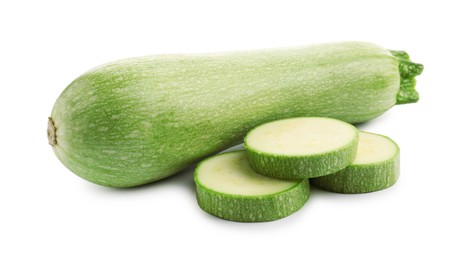 Photo of Fresh whole and cut zucchinis isolated on white
