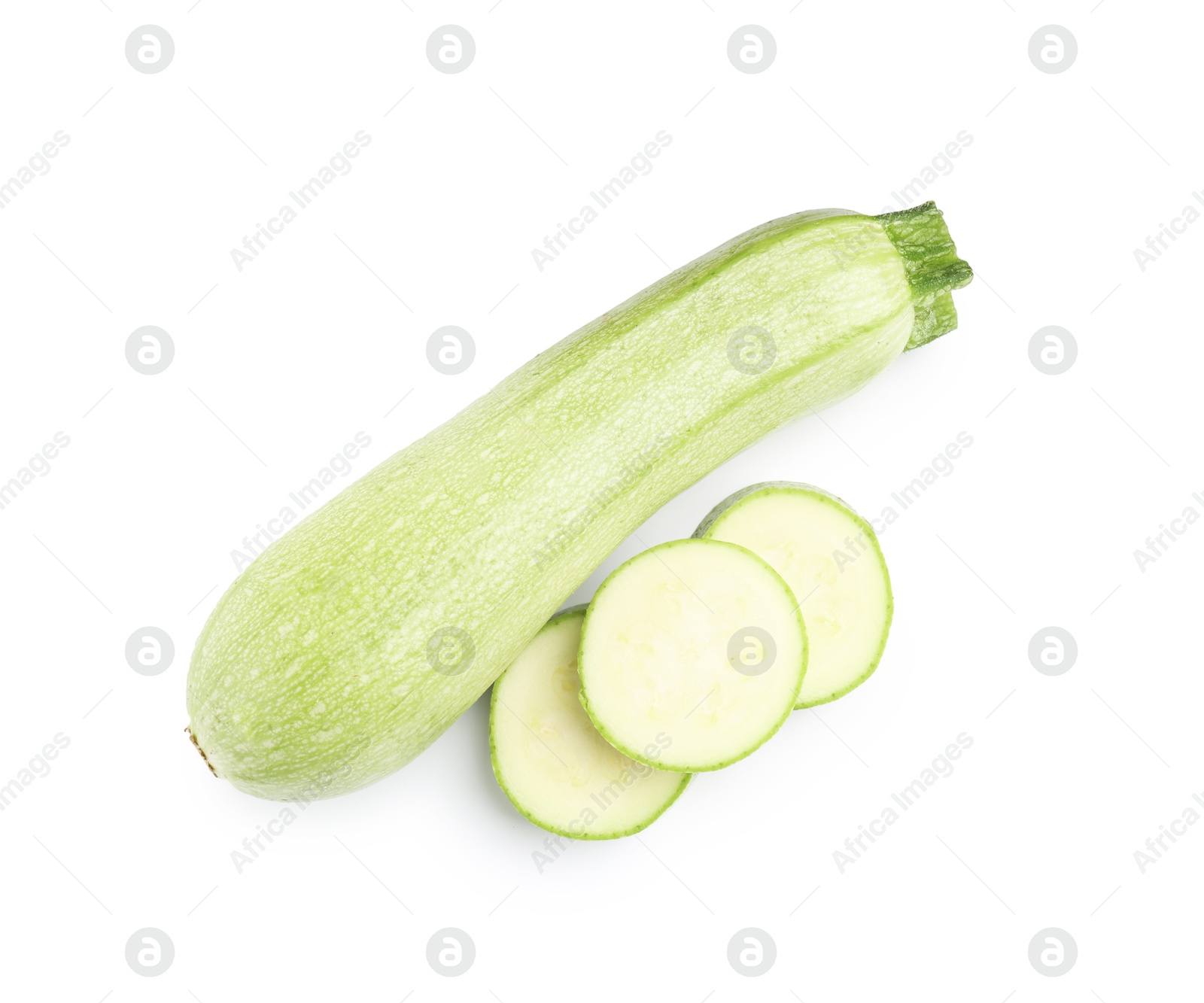 Photo of Fresh whole and cut zucchinis isolated on white, top view