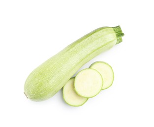 Photo of Fresh whole and cut zucchinis isolated on white, top view