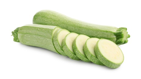 Photo of Fresh whole and cut zucchinis isolated on white
