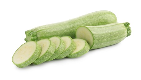 Photo of Fresh whole and cut zucchinis isolated on white