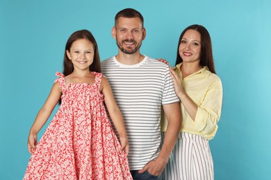 Photo of Portrait of happy family on light blue background