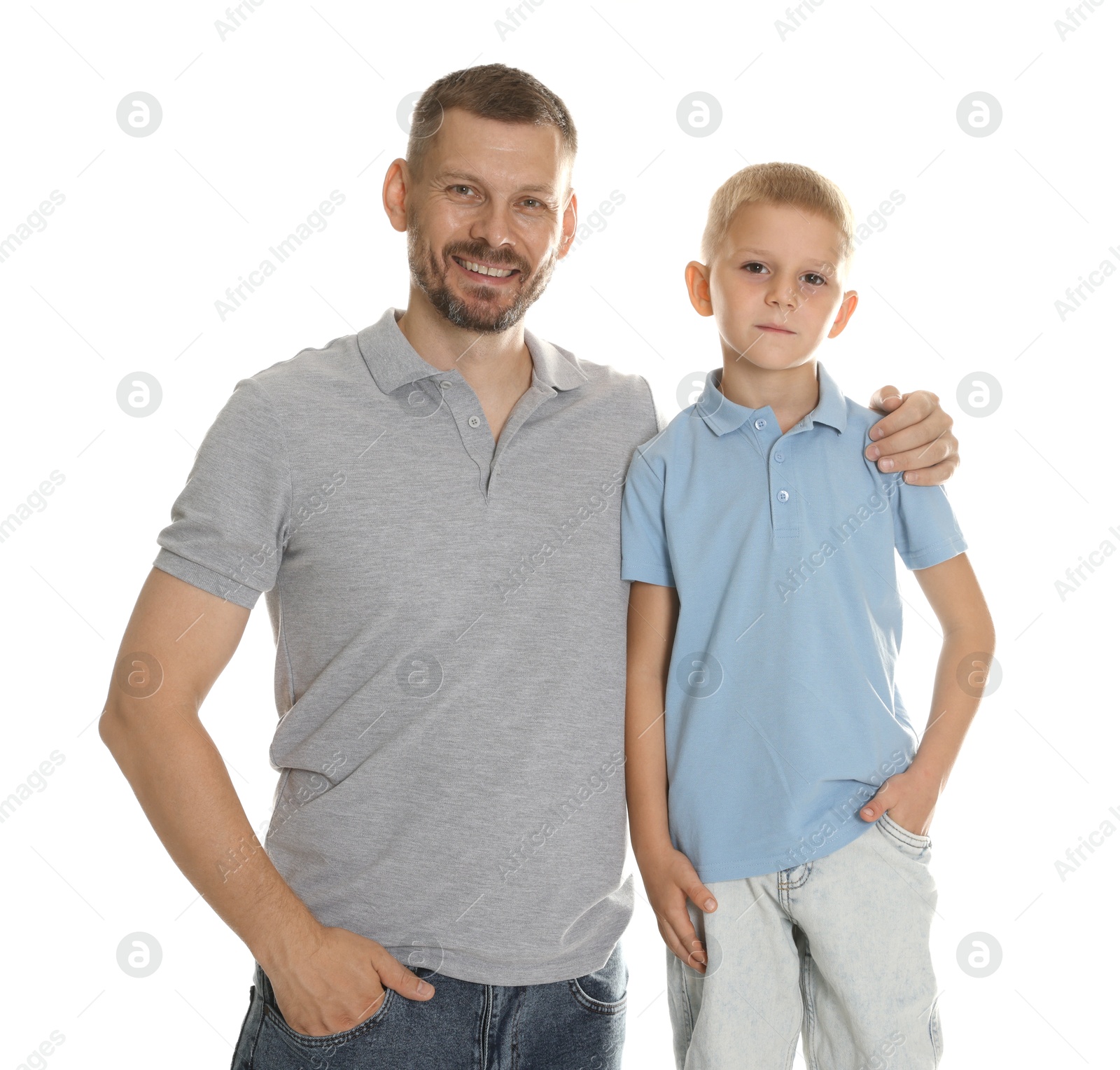 Photo of Father and son posing together on white background