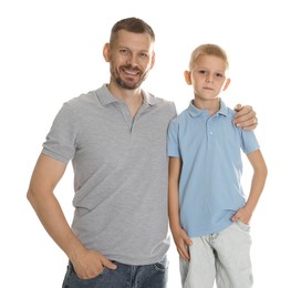 Photo of Father and son posing together on white background
