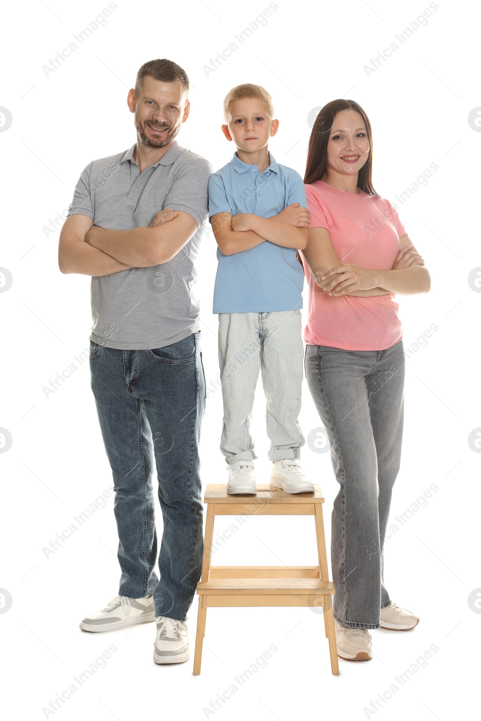Photo of Lovely family posing together on white background