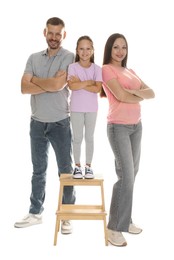 Photo of Lovely family posing together on white background