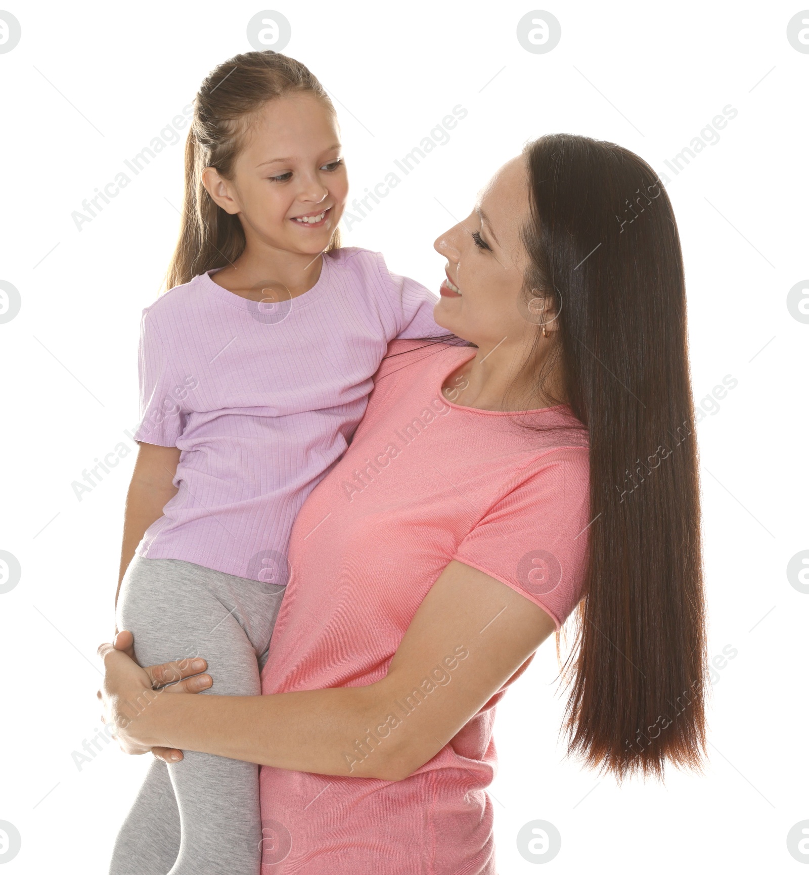 Photo of Mother and daughter posing together on white background