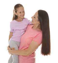 Photo of Mother and daughter posing together on white background