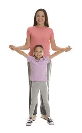 Photo of Mother and daughter having fun on white background
