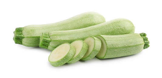 Photo of Fresh whole and cut zucchinis isolated on white