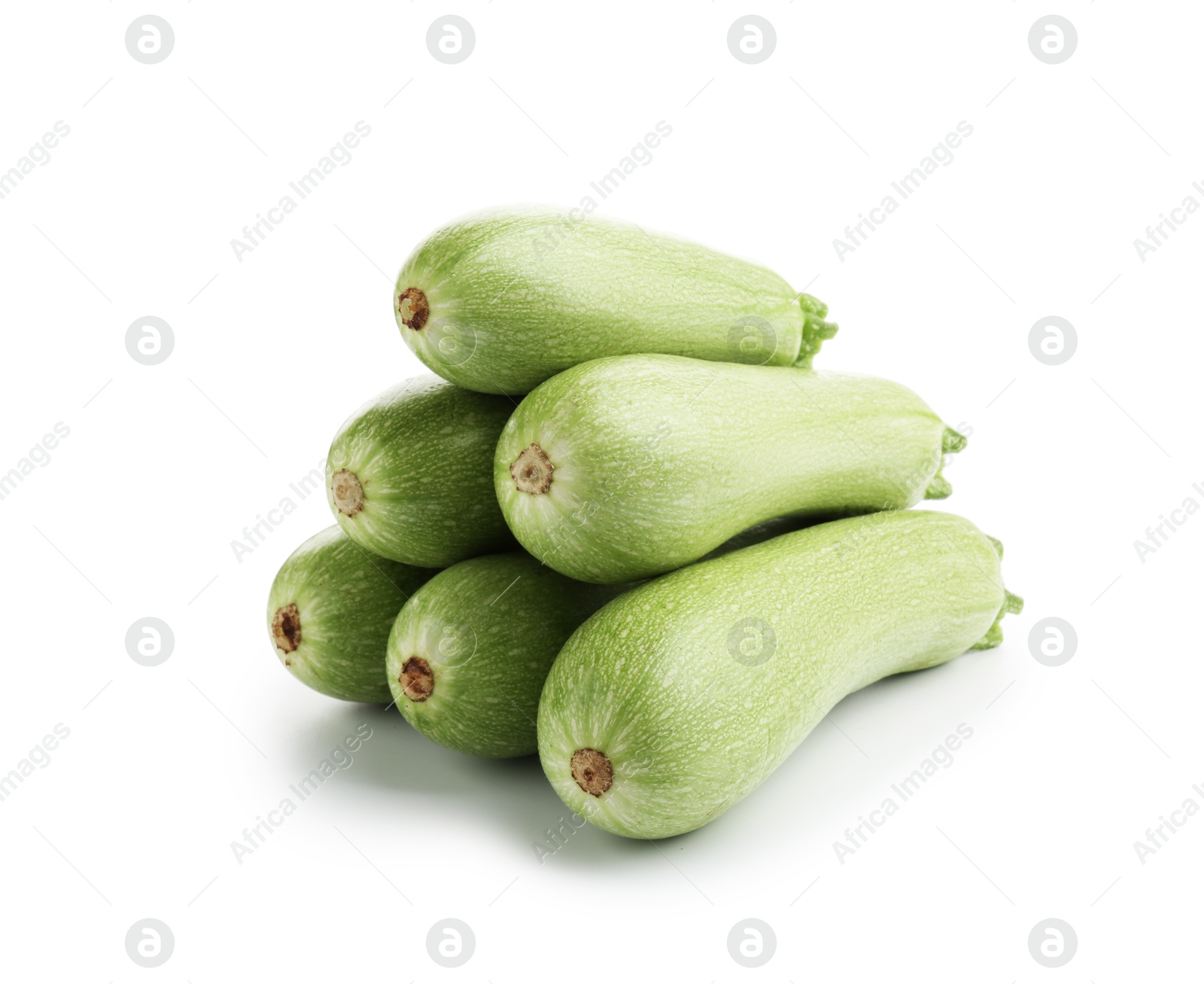 Photo of Many fresh ripe zucchinis isolated on white