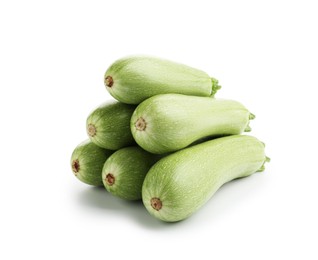 Photo of Many fresh ripe zucchinis isolated on white