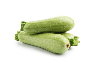Photo of Many fresh ripe zucchinis isolated on white