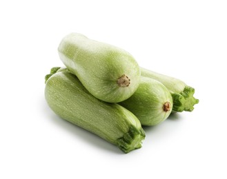 Photo of Many fresh ripe zucchinis isolated on white