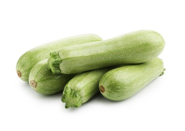 Photo of Many fresh ripe zucchinis isolated on white