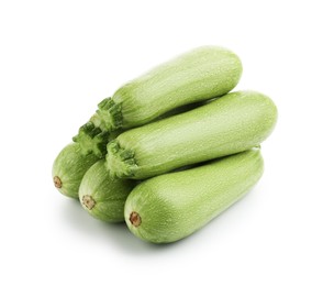 Photo of Many fresh ripe zucchinis isolated on white