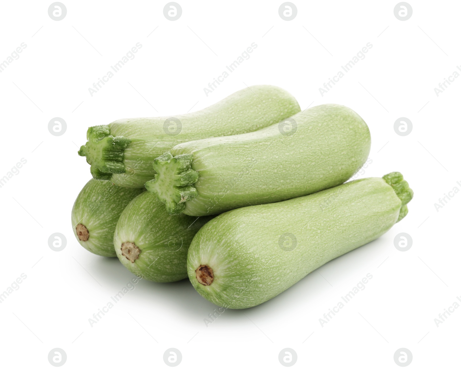 Photo of Many fresh ripe zucchinis isolated on white
