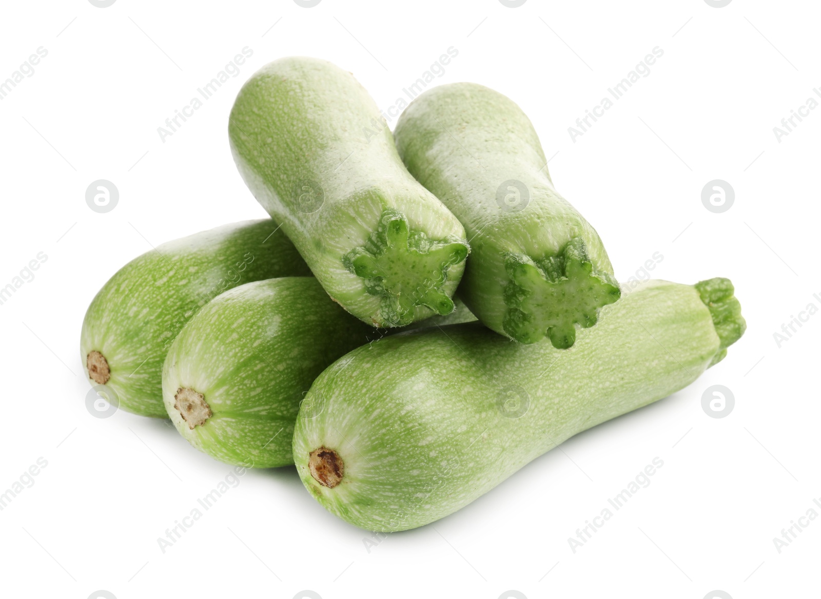 Photo of Many fresh ripe zucchinis isolated on white