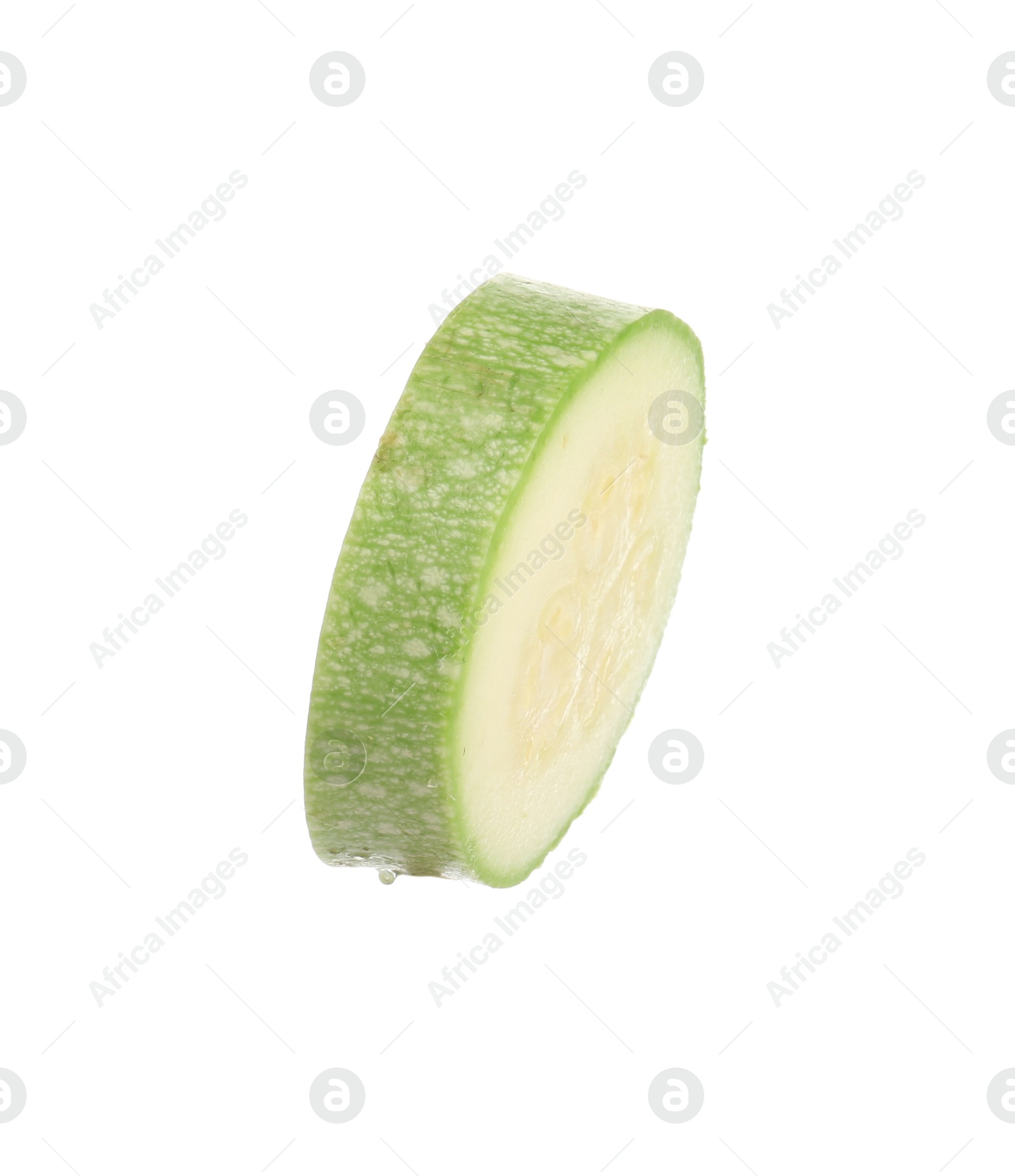 One slice of fresh zucchini isolated on white Photo of One slice of fresh zucchini isolated on white
