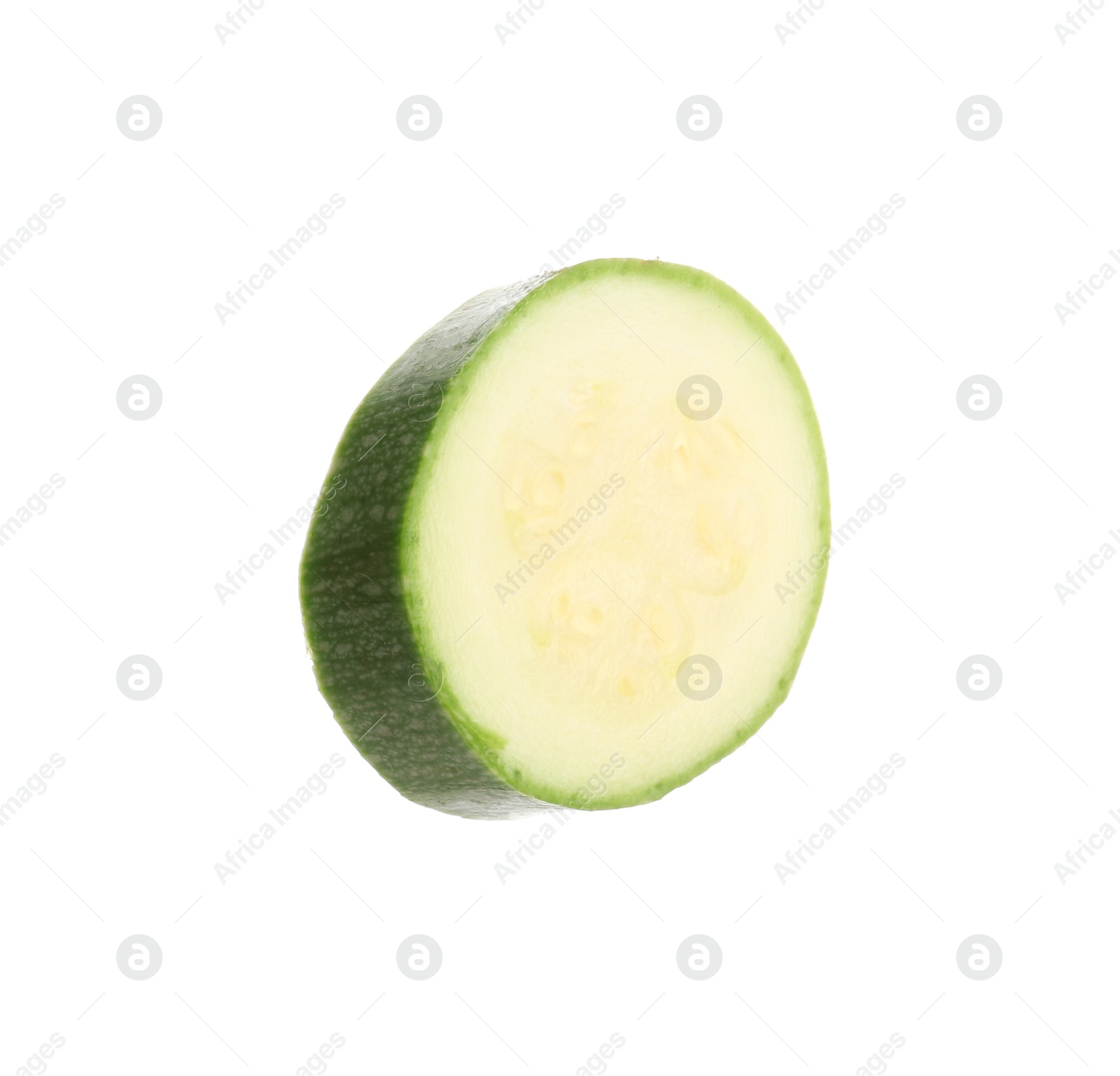 One slice of fresh zucchini isolated on white Photo of One slice of fresh zucchini isolated on white