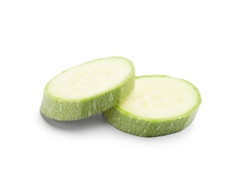 Photo of Slices of fresh zucchini isolated on white