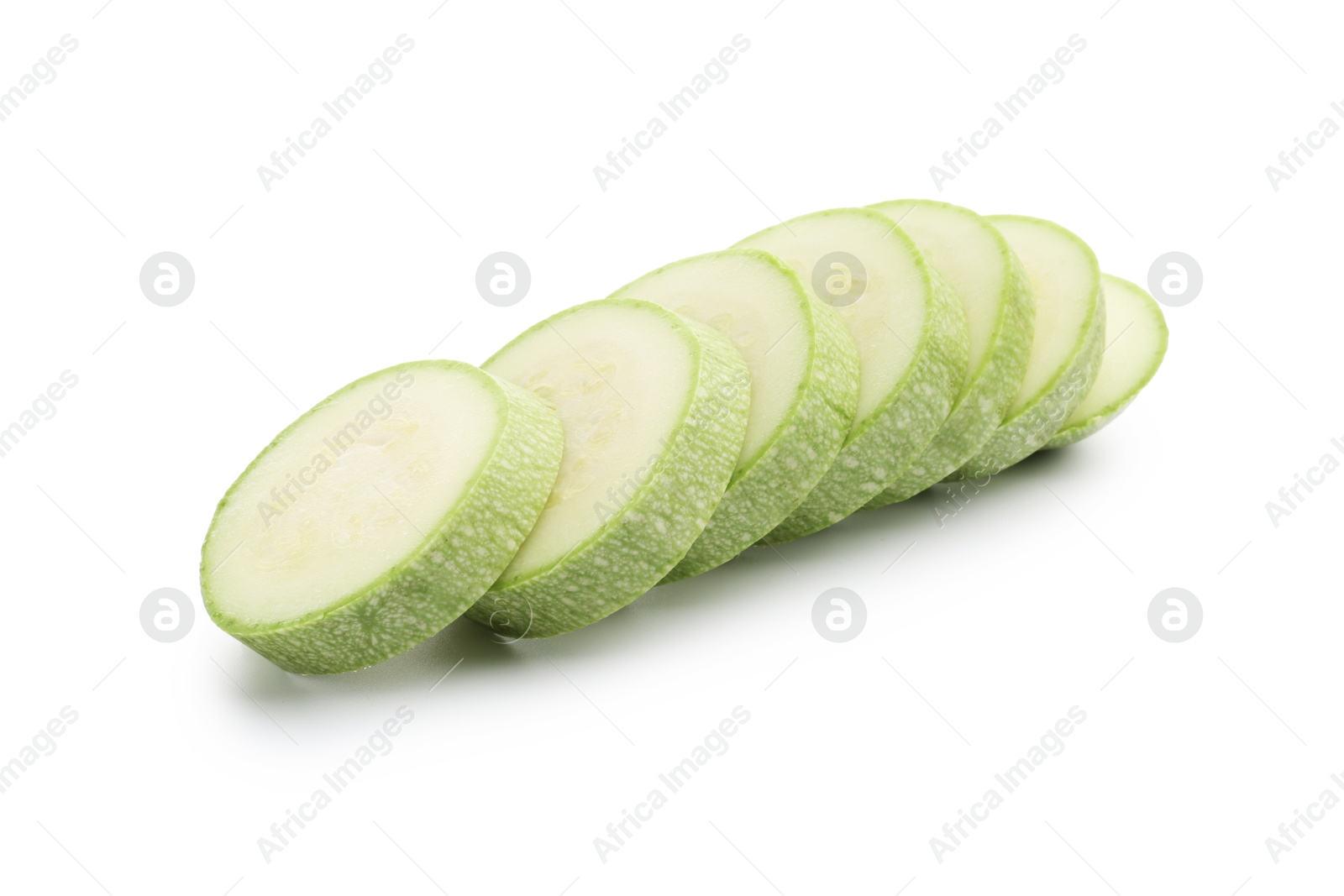 Slices of fresh zucchini isolated on white Photo of Slices of fresh zucchini isolated on white