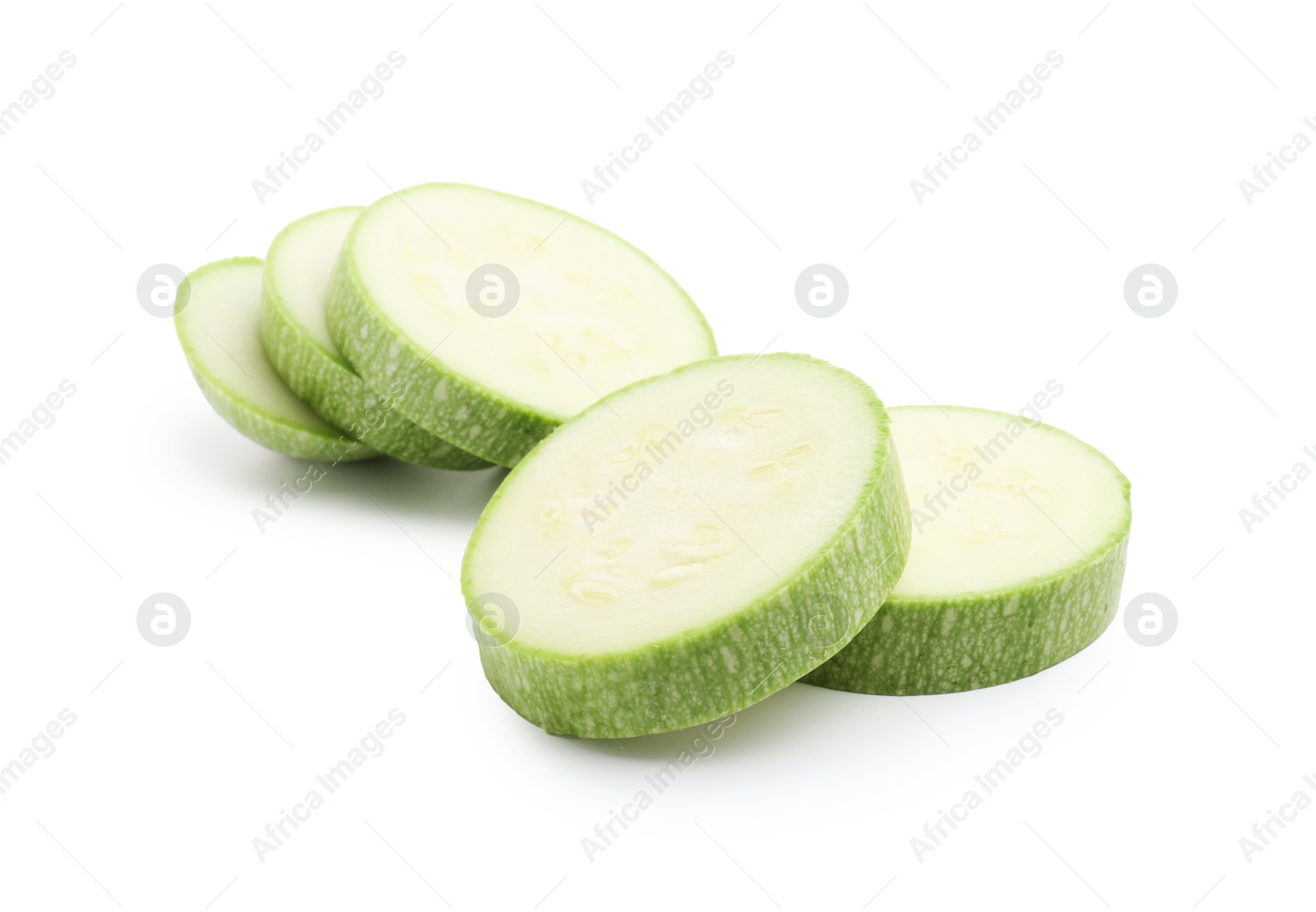 Slices of fresh zucchini isolated on white Photo of Slices of fresh zucchini isolated on white