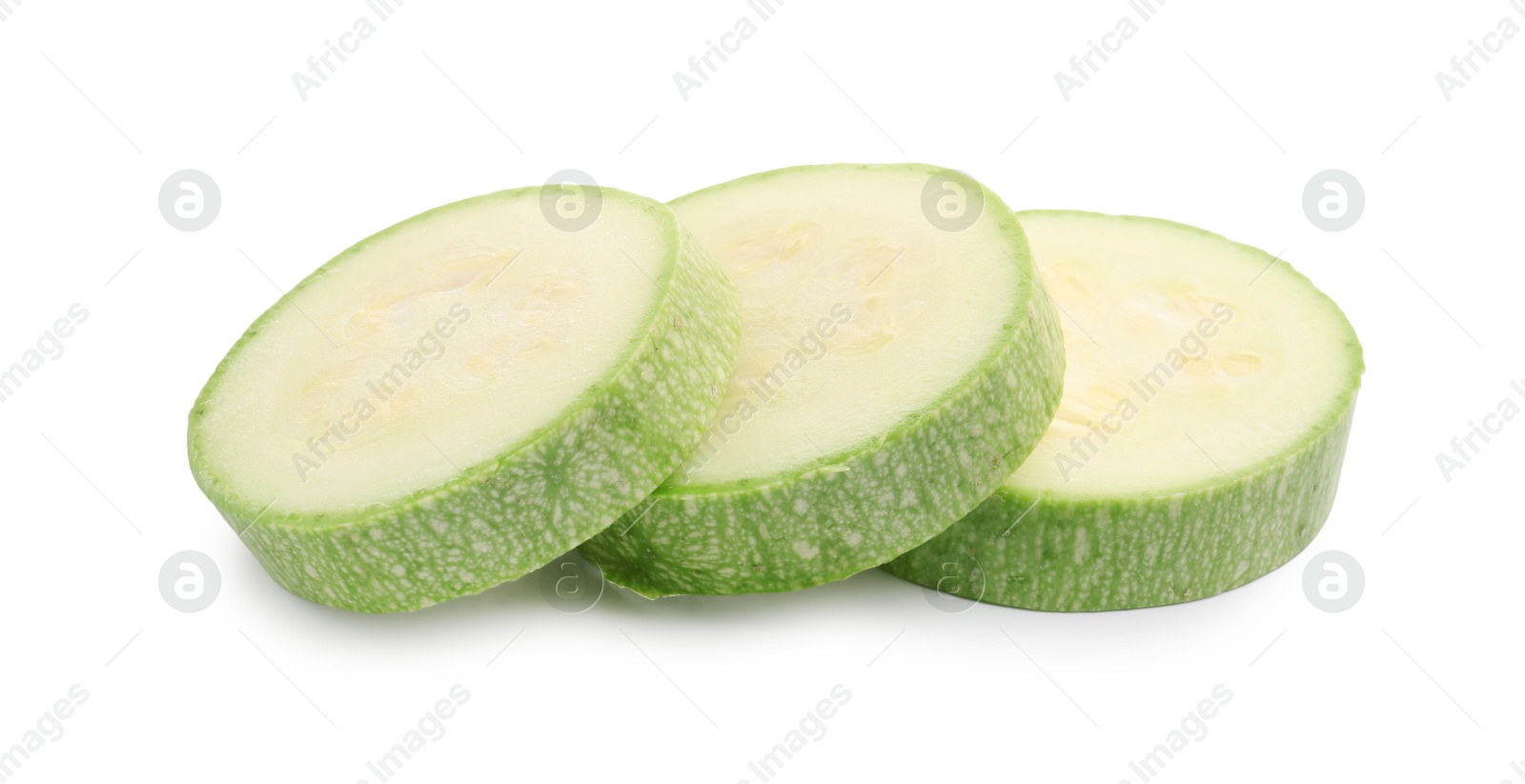 Slices of fresh zucchini isolated on white Photo of Slices of fresh zucchini isolated on white