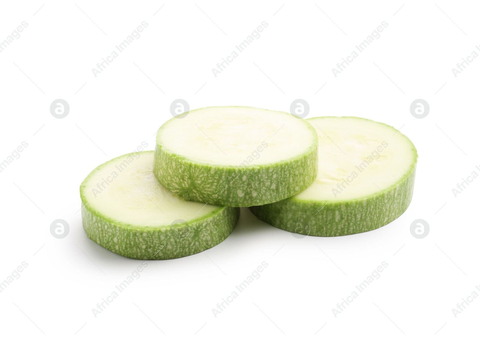 Slices of fresh zucchini isolated on white Photo of Slices of fresh zucchini isolated on white