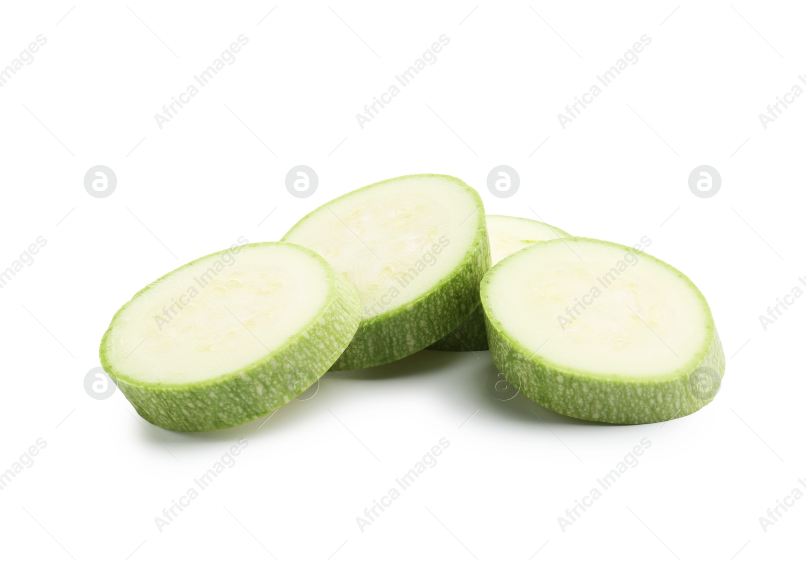 Slices of fresh zucchini isolated on white Photo of Slices of fresh zucchini isolated on white