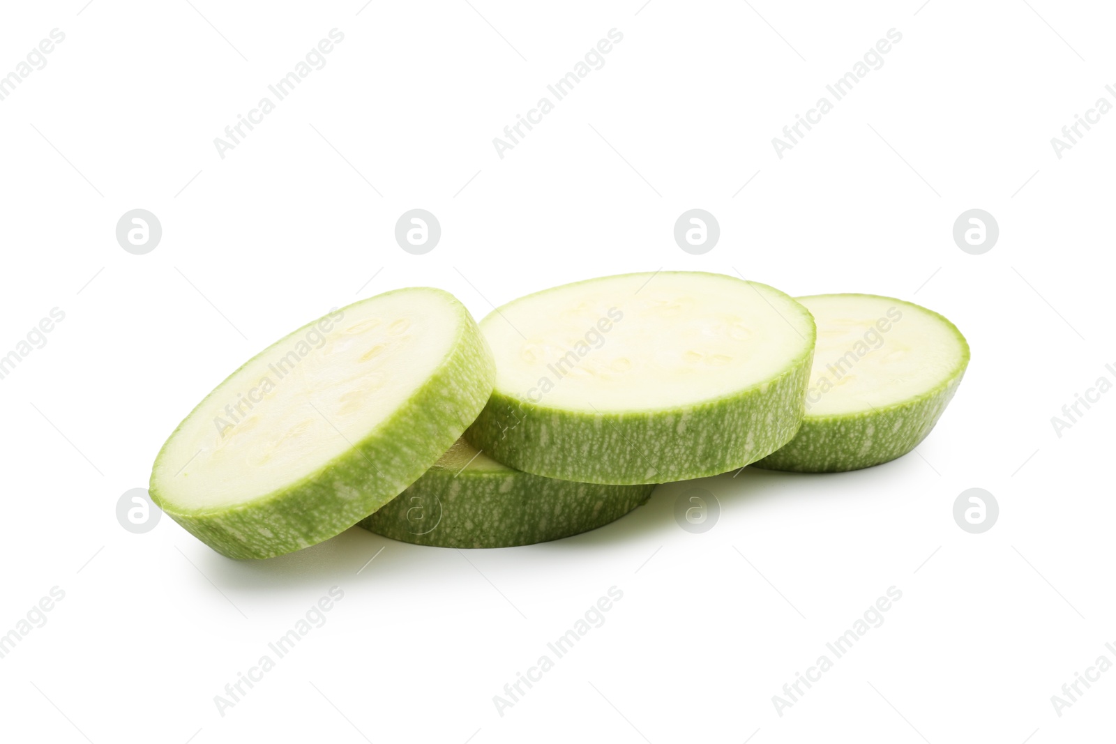 Slices of fresh zucchini isolated on white Photo of Slices of fresh zucchini isolated on white