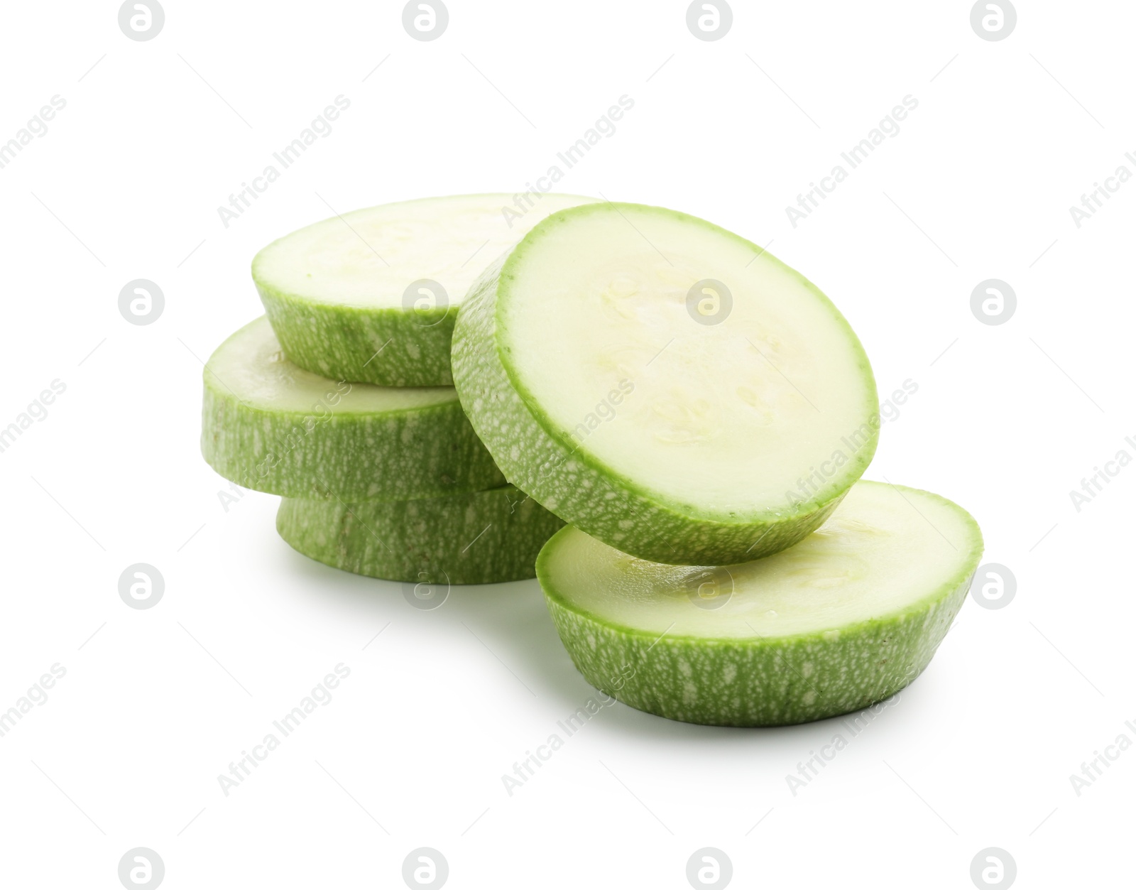Slices of fresh zucchini isolated on white Photo of Slices of fresh zucchini isolated on white